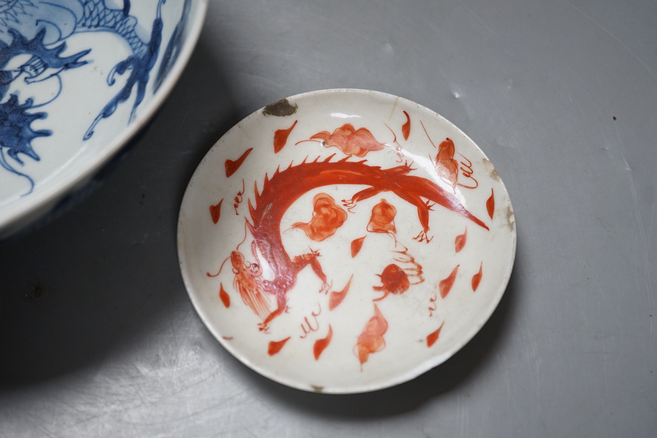 A 19th century Chinese ‘dragon’ bowl, together with a smaller ‘dragon’ dish. Largest 18.5cm diameter